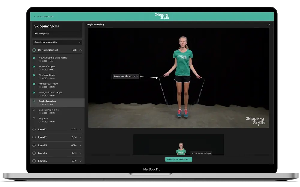 The Skipping Skills web course open on a laptop, showing the lesson list and a video
